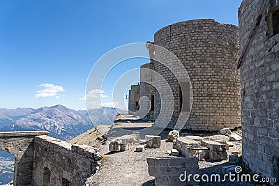 View of ruins of artillery batteries against a background of mountains in Mont Chaberton peak Stock Photo