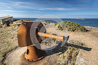 View from ruins of Beniguet bastion in Beg er Vachif peninsula in west of Houat island, old rusted canon is at foreground. French Stock Photo