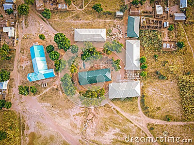 View of rural buildings surrounded by green vegetation. Kurba, Gombe, Nigeria. Stock Photo