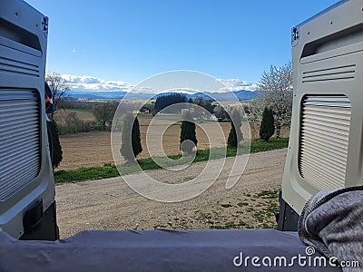 View into the rural carinthian landscape in austria. Vanlife and Freedom concept - digital nomad life. Stock Photo