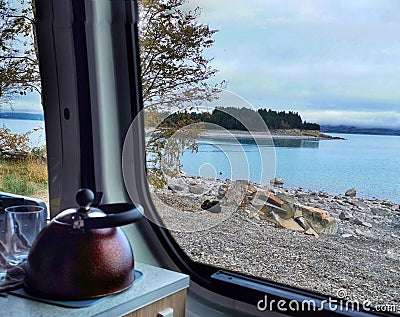 A view from rv window on a lake with blue glacier water Stock Photo