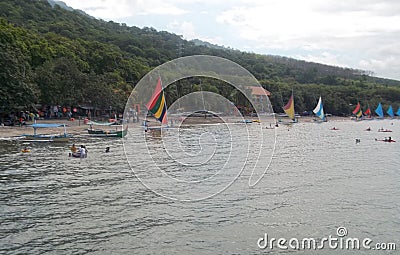 The view of sailboats on the seaside with rural background Stock Photo