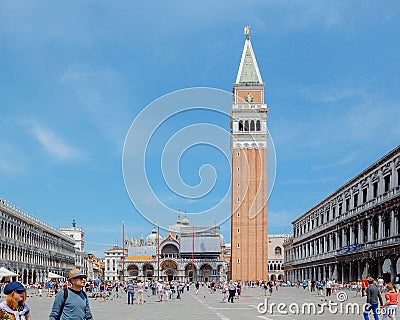 View of Saint Mark Square with tourists on summer day. Dodge Palace, Campanile on Piazza San Marco, Venice, Italy Editorial Stock Photo