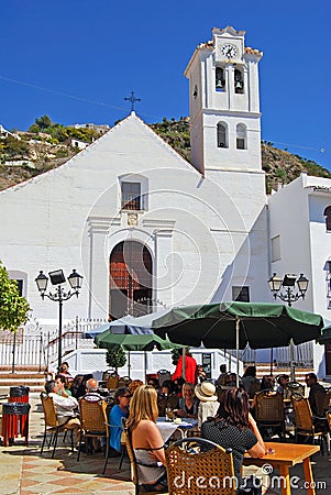 Cafe by church, Frigiliana, Spain. Editorial Stock Photo