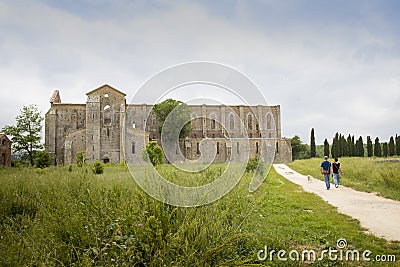 View of san galgano abbey from outside two people walking Editorial Stock Photo