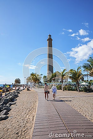 View of sandy beach and famous Maspalomas Lighthouse under blue sky Editorial Stock Photo