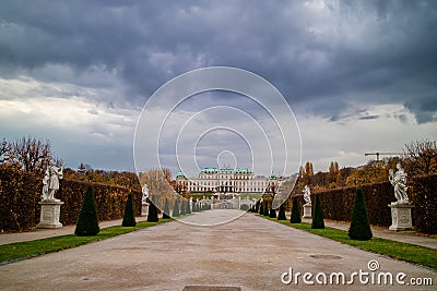 View of Schloss Belvedere Palace with walking alley and ancient statues in Vienna. Stock Photo