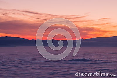 View from Schoeckl over low stratus to Karawanks, Triglav, sunset Stock Photo