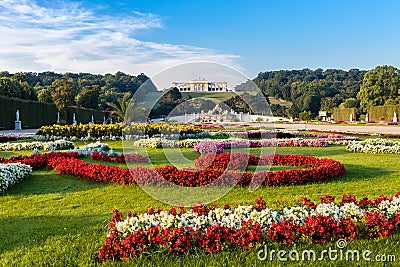 View on Schonbrunn Palace and garden with colorful flowers, Austrian flag made of flowers Editorial Stock Photo