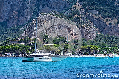 View from the sea of the bay and Mondello beach, catamaran anchored in the bay Stock Photo