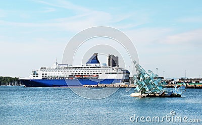 View of the sea ferry moored to the pier on a clear sunny day. Travel Editorial Stock Photo