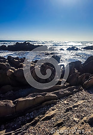 View of the sea with rocks from the sea shore Stock Photo