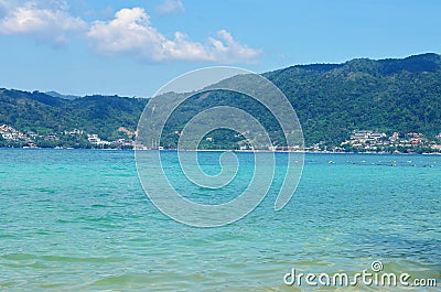 View of the sea, sky and mountains overgrown with jungle Tri Trang Beach in Phuket Stock Photo