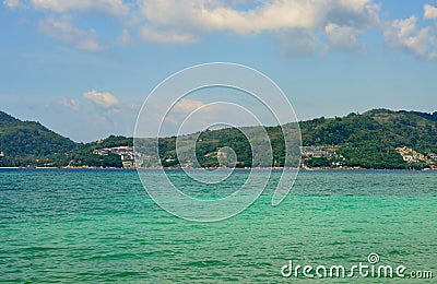 View of the sea, sky and mountains overgrown with jungle Tri Trang Beach in Phuket Stock Photo