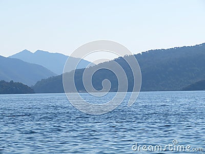 View from the sea to the mountainous islands, coast in the morning Stock Photo