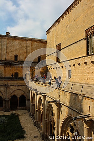 View from the second floor of the courtyard and stone carved arches of the Poblet monastery cat. Reial Editorial Stock Photo