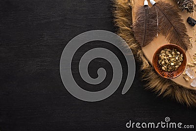 View of shamanic tambourine with feathers Stock Photo