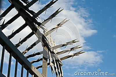 SHARP PRONGED EXTENSION ON A METAL RAILING Stock Photo