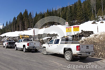 View of sign on Trans-Canada Highway `Danger. Avalanche Control using Explosives. Editorial Stock Photo