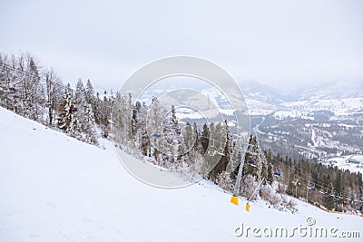 view of ski resort lift mountains in fog Stock Photo