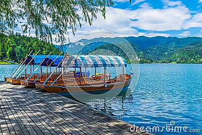 Slovenia Traditional Pletna boat is waiting for you at Bled Lake Stock Photo