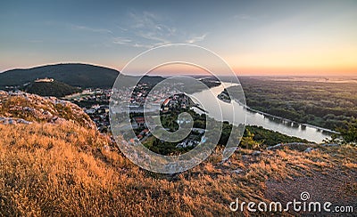 View of Small City with River from the Hill at Sunset Stock Photo