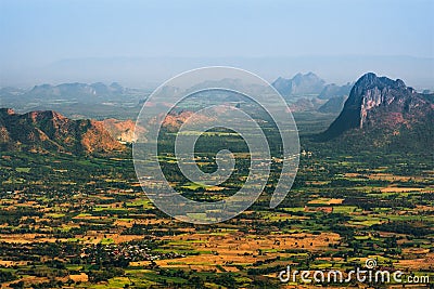 View small village in valley from top mountain on smog day Stock Photo