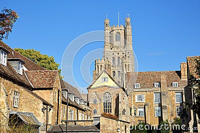 View of the South part of the Cathedral of Ely in Cambridgeshire, with medieval houses in the foreground Stock Photo