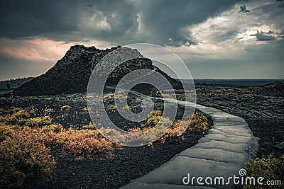 View of the spray cone trail on the horizon, lava hills, volcanic landscape Stock Photo