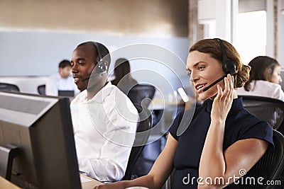 View Of Staff In Busy Customer Service Department Stock Photo