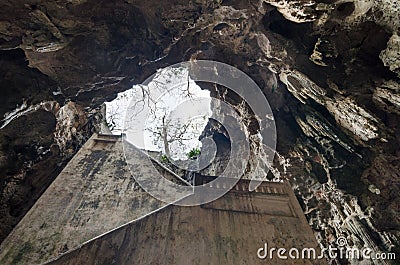 Stairs leading to the cave mouth of Tham Khao Luang temple cave, Phetchaburi, Thailand Stock Photo