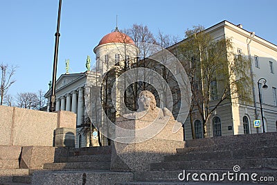 View of the stone lion and the building with the dome Stock Photo