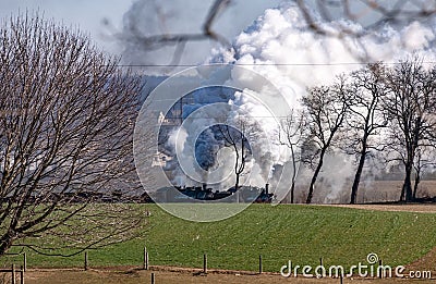 View of a Steam Double Header Freight Train Traveling Thru Rural America on a Sunny Winter Day Stock Photo