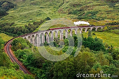 View of a steam train on a famous Glenfinnan viaduct, Scotland Stock Photo