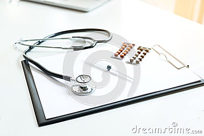 View of stethoscope, drug and equipment on foreground table, Health care and Medical concept Stock Photo