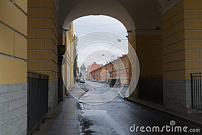 St. Petersburg, Russia, October 28, 2023. View of a city street through the arch of a building. Editorial Stock Photo