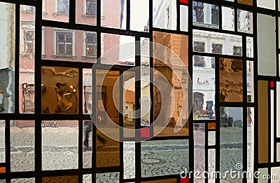 View on the street through the window made of colored oblong panes Stock Photo