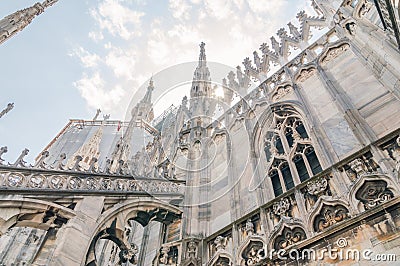 View for sun light with detail of the roof of Milan Cathedral. Stock Photo