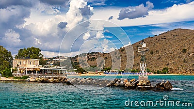 View of sunbeds awaiting tourists at the Greek island resort of Georgioupolis on Crete north coast. Georgioupoli is a resort Stock Photo