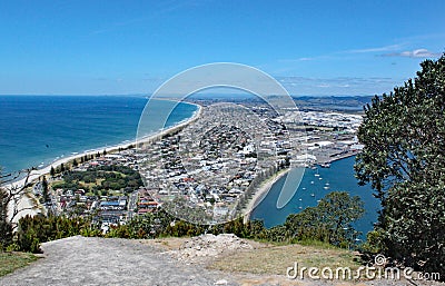 View of Tauranga from Mount Maunganui in New Zealand. Many people are on the beach enjoying the perfect weather Stock Photo