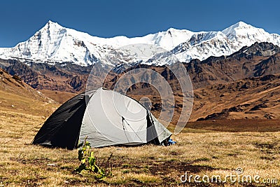 View of tent, Putha Churen Himal and Dhaulagiri Himal Stock Photo