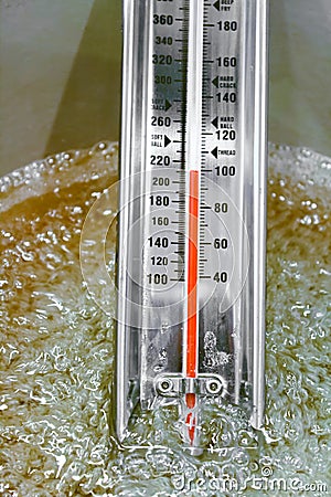 View of a thermometer as it reaches boiling point Stock Photo