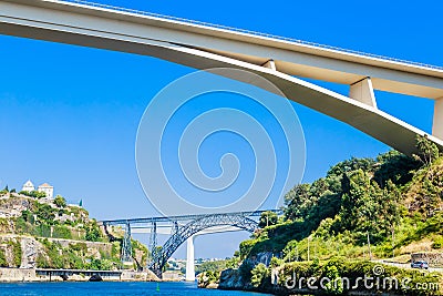 Three bridges connecting Porto and Vila Nova de Gaia: Infante D. Henrique Bridge and railway bridges Maria Pia old and Editorial Stock Photo