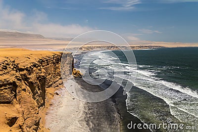 View to cliffs, desert and the Pacific ocean in Paracas Stock Photo