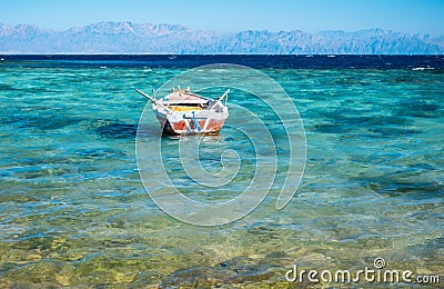 View to coastline of Red sea and fishing boat Stock Photo