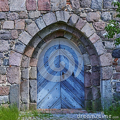 View to the entrance of a medieval village church in Germany Stock Photo
