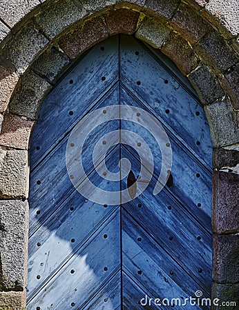 View to the entrance of a medieval village church in Germany Stock Photo