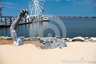 View to Ferris wheel and yacht marina pier on the Potomac River in National Harbor, Maryland Editorial Stock Photo