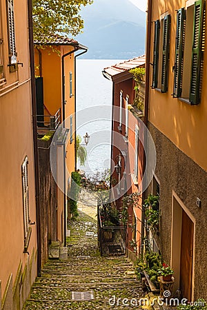 View to the Italian Lake Como from one of the narrow streets. Stock Photo