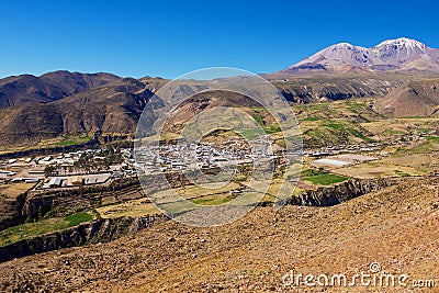 View to Putre town backdropped by Taapaca volcanic complex in the Parinacota Province in the Arica-Parinacota Region in Chile. Editorial Stock Photo